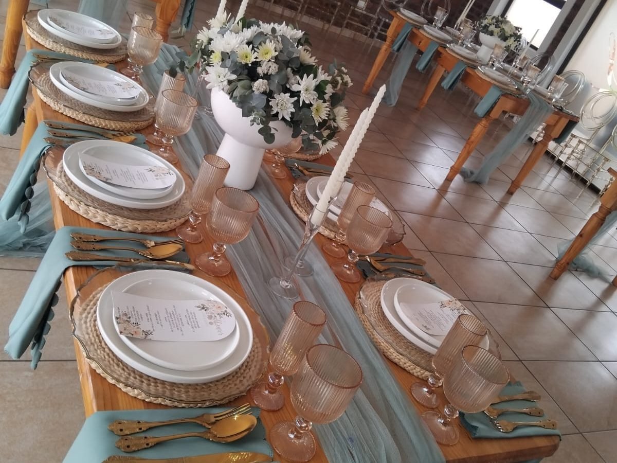 Function hall set with teal and blush table settings